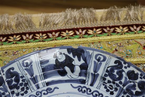 Two Delft blue and white dishes, late 17th century, 34 and 36cm, faults